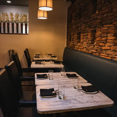 Interior,diner area, tables by the stone wall
