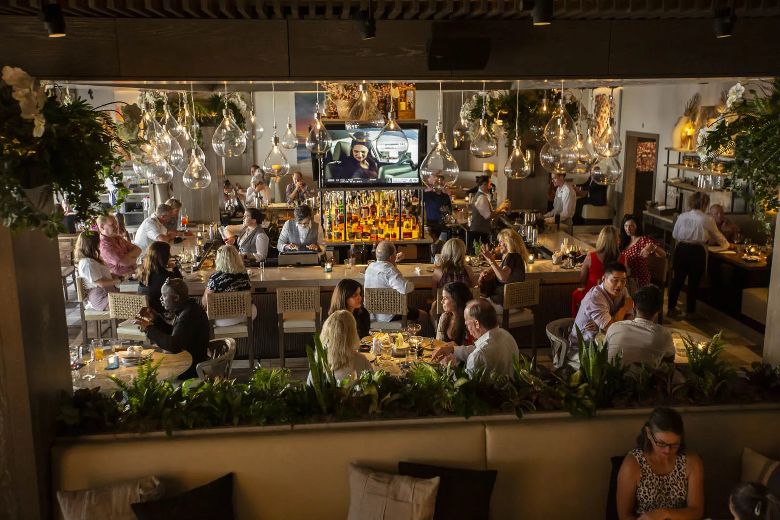 Dining room filled with guests at Del Mar Naples restaurant in Florida.