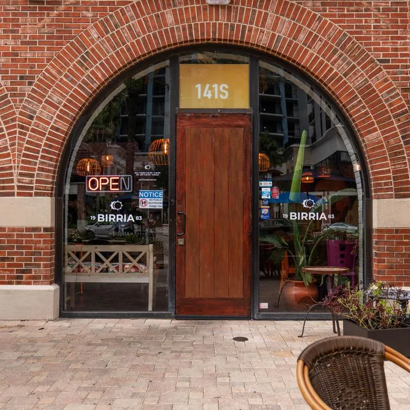 Birria 83 front door and sign.
