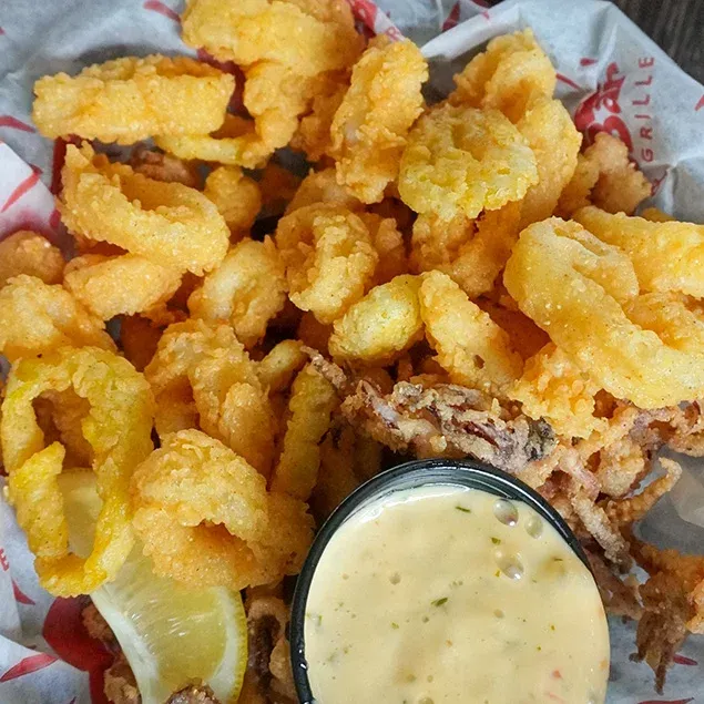 Hand breaded Calamari & banana peppers fried golden. Served with our sweet chili garlic sauce