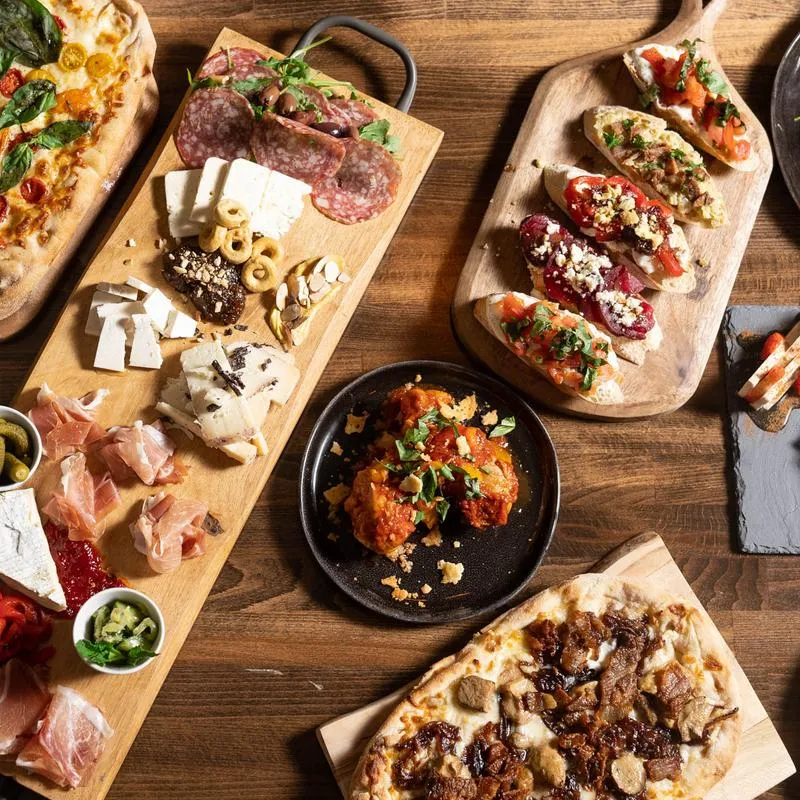 Various prepared dishes served on boards and plates