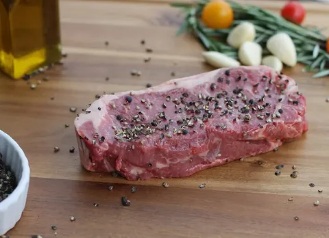 Fresh Steak seasoned with pepper