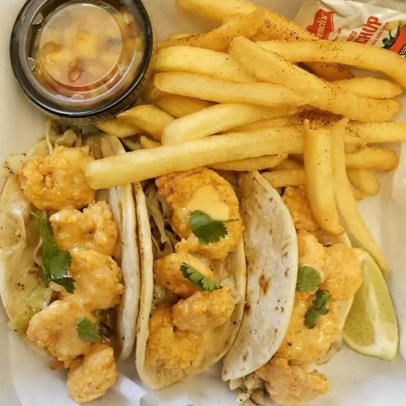 Shrimp tacos and fries.