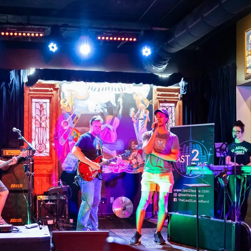 A band performing live on a stage inside.