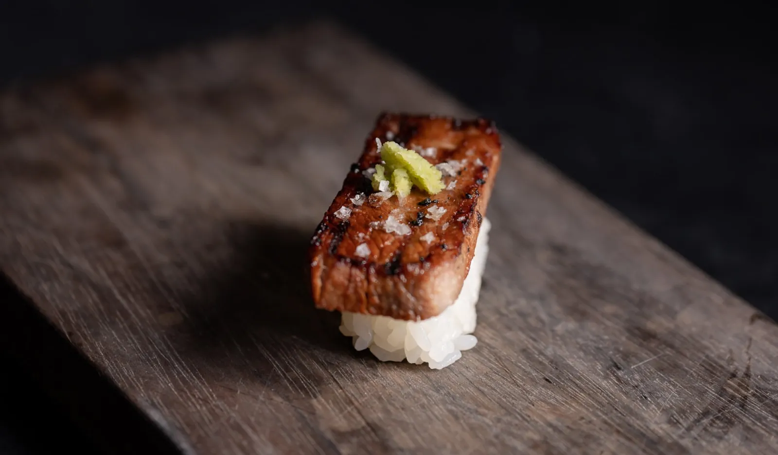 uchi miami sushi restaurant gyutoro nigiri with grilled wagyu beef over sushi rice