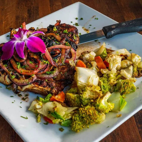 Grilled rib eye with grilled vegetables.