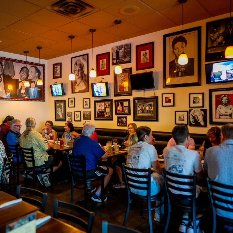 Interior of a restaurant with people dining.