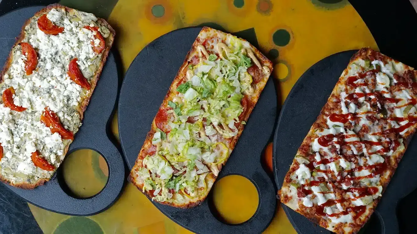 three gourmet flatbread pizzas