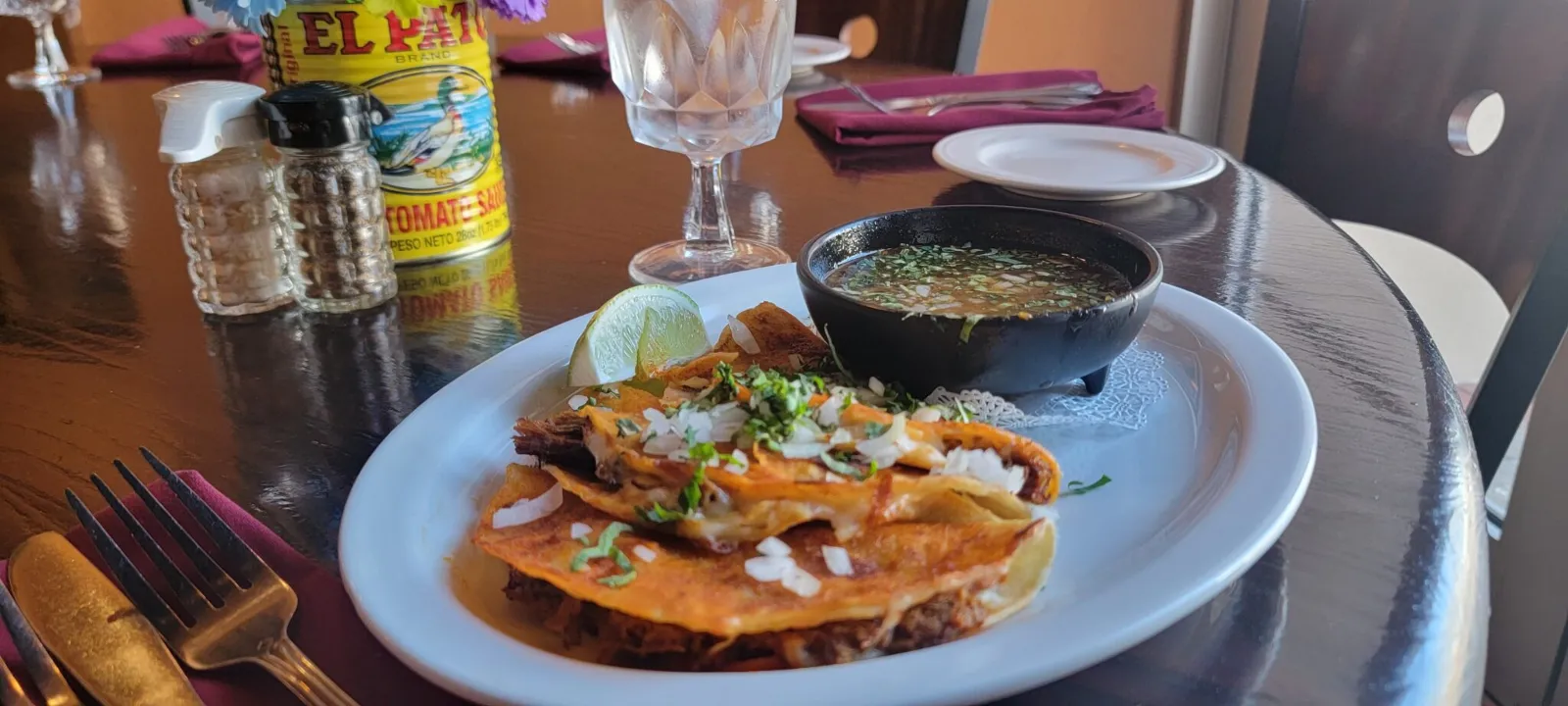 Birria tacos at Flaco's Restaurant of Naples. Served with beef consemme, rice, beans and of course our fresh made daily salsa and chips are complimentary