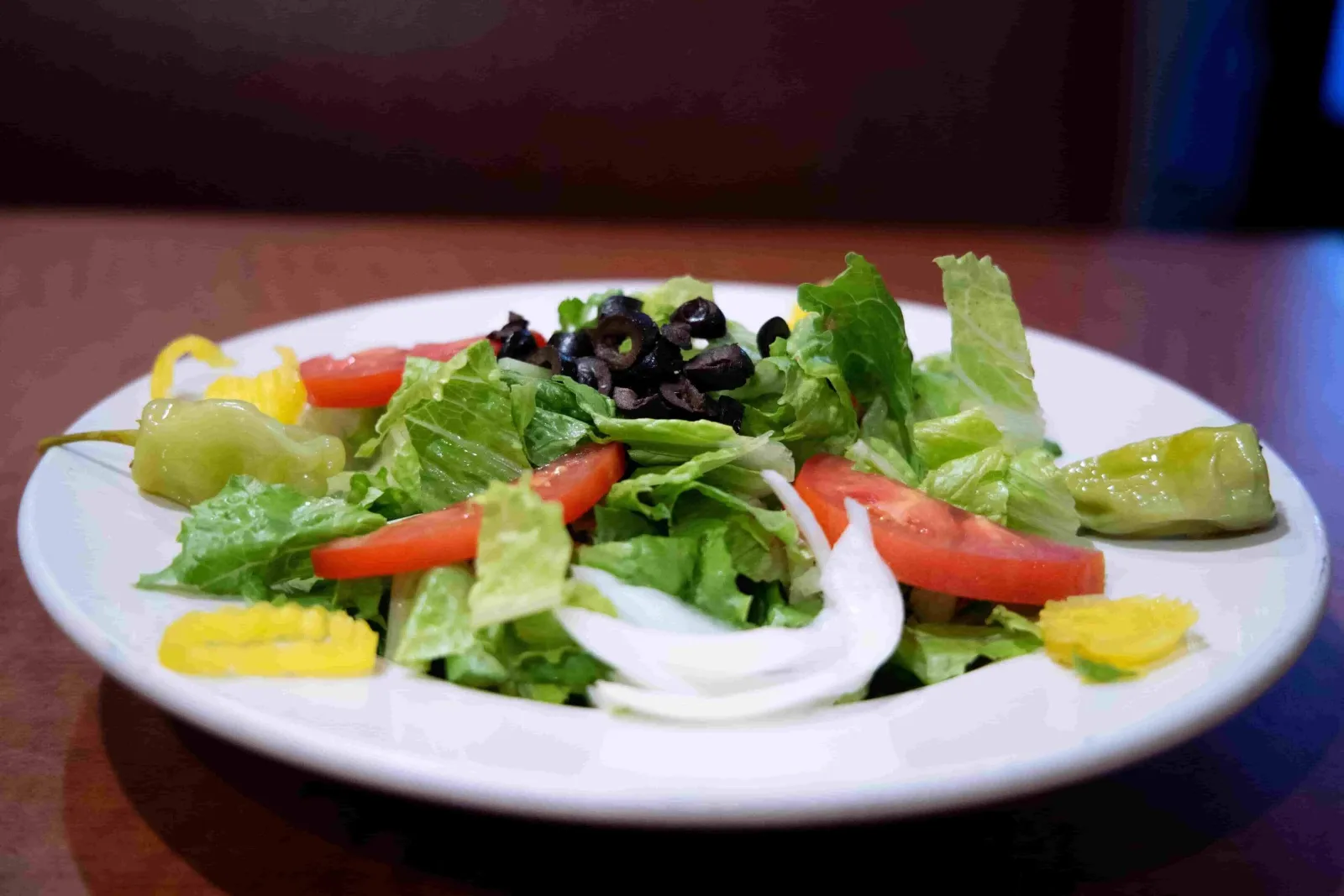 Fresh house salad with olives and tomatoes
