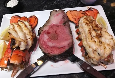 A plate of food with meat and vegetables on it
