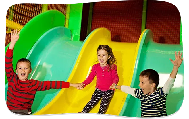 Children on slide at indoor playground