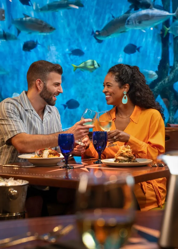 A Couple Sitting At A Table