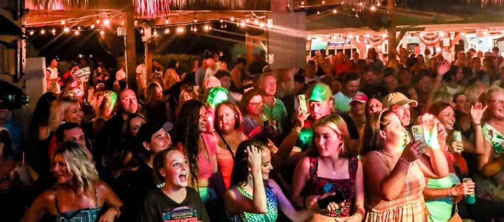 packed tiki bar, people are watching live music