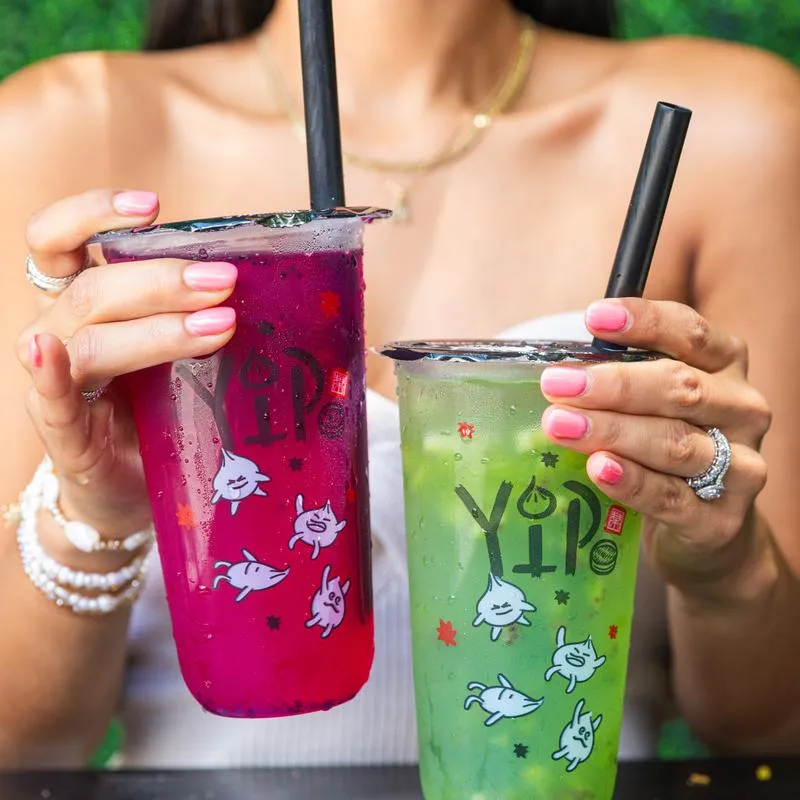 Hands holding drinks.