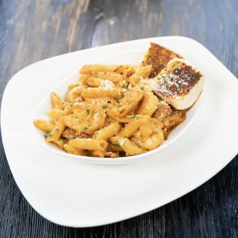 Cajun shrimp sausage pasta served with toasted bread.