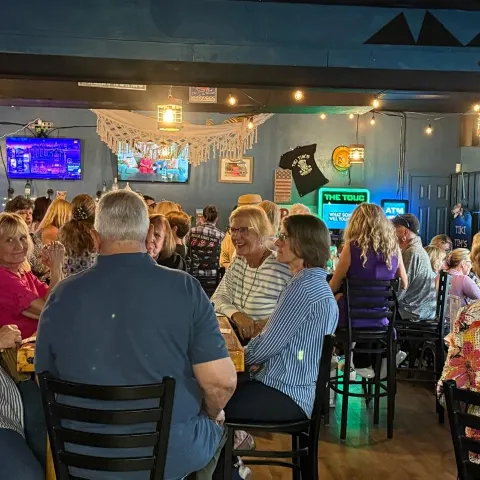 Interior, crowded seating area.