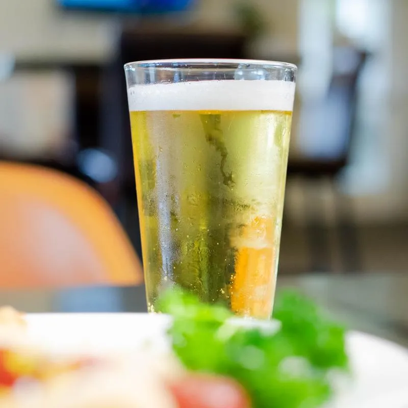 Beer served in a pint glass.
