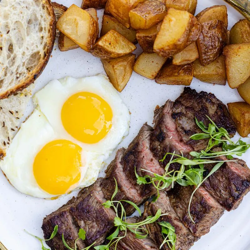 Steak, eggs, and potatoes.