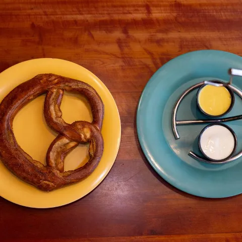 Large Bavarian Pretzel with beer cheese and honey mustard dipping sauces.