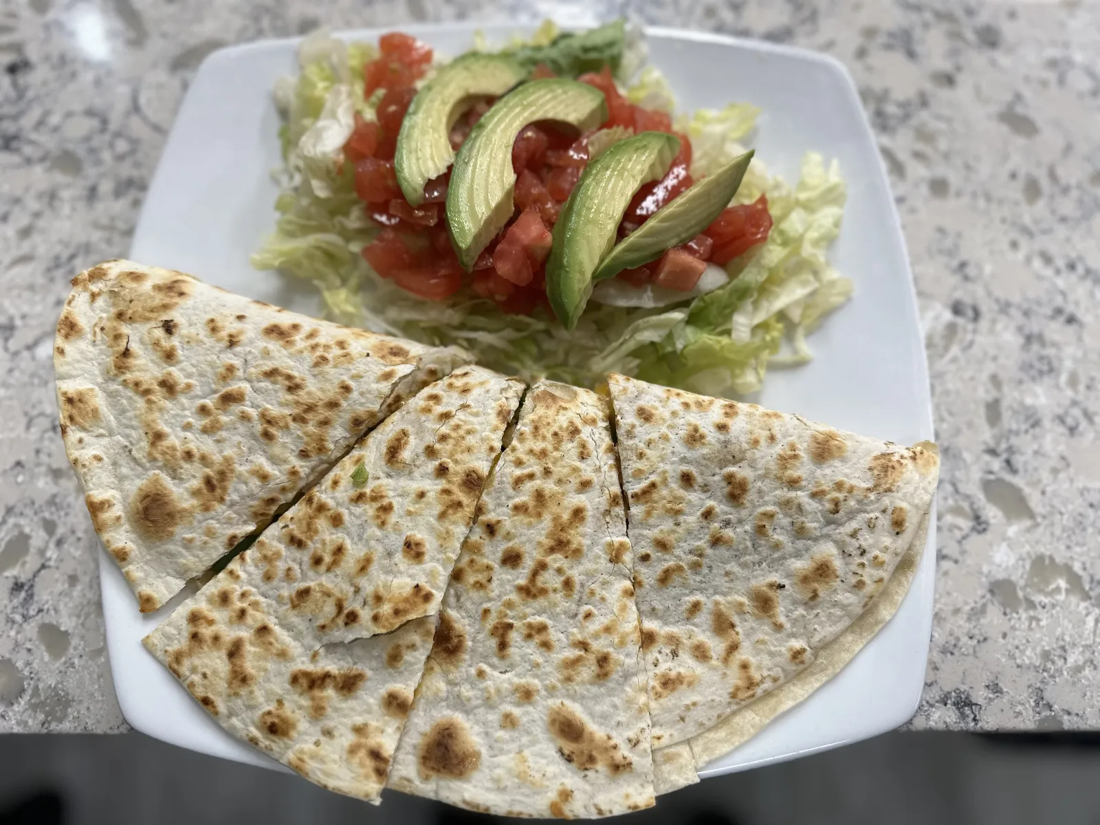 Chicken Quesadilla: Tender chicken, sautéed onions, and green peppers wrapped in a warm flour tortilla, melted to perfection. A flavorful favorite at Bayside Sports Bar and Grille