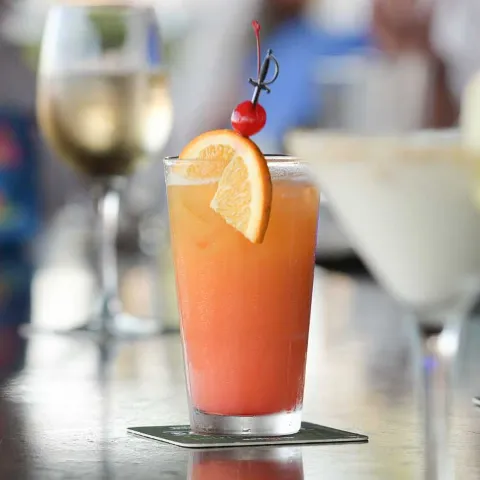 variety of drinks together on the bar including cocktail, martini, and wine glass