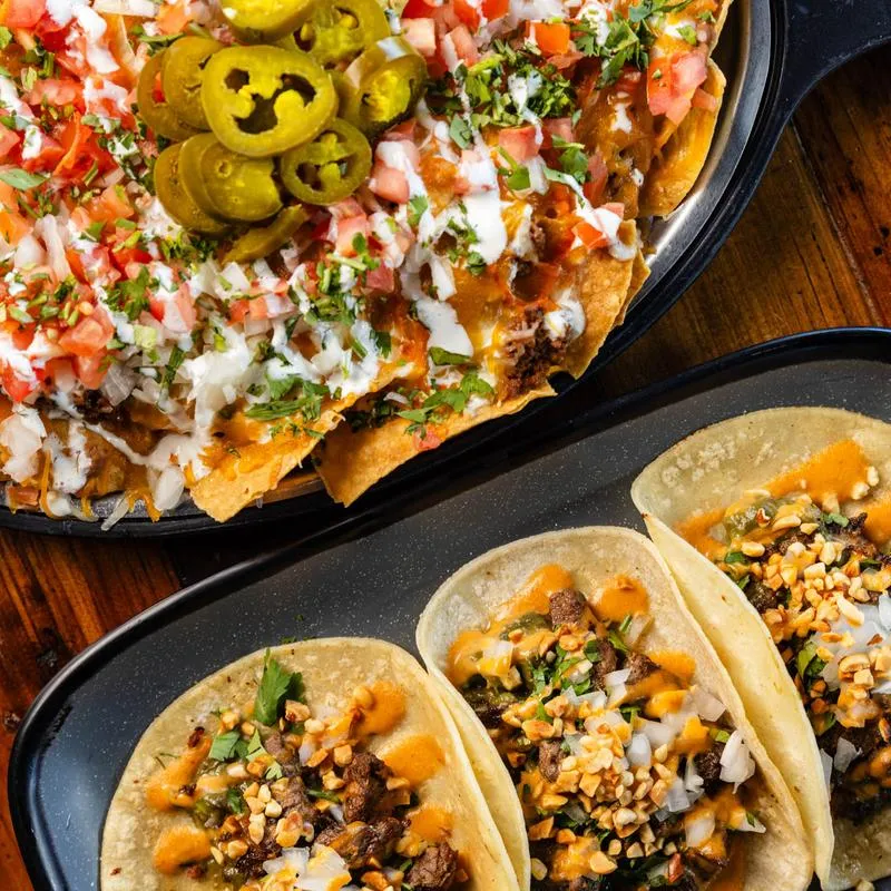 Tacos al pastor and nachos.