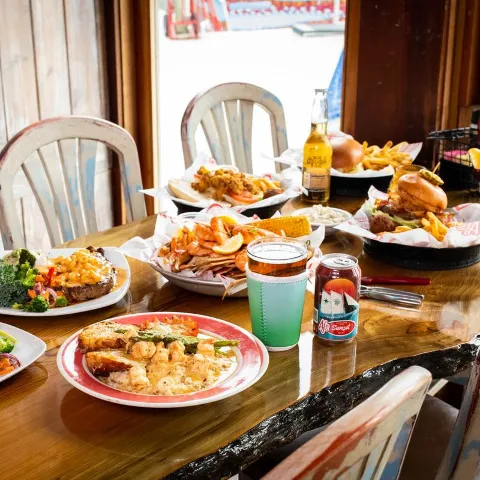 Table spread with assorted dishes and drinks