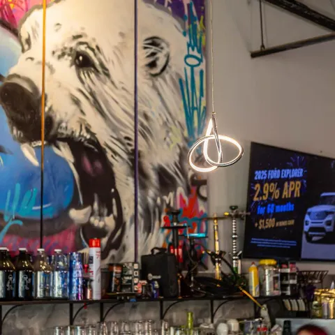 Interior with graffiti art of a polar bear on the wall.