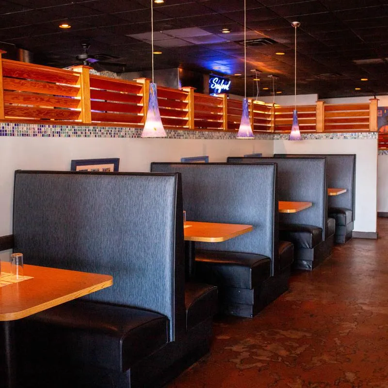 Restaurant booths with tables designed for wheelchair accessibility