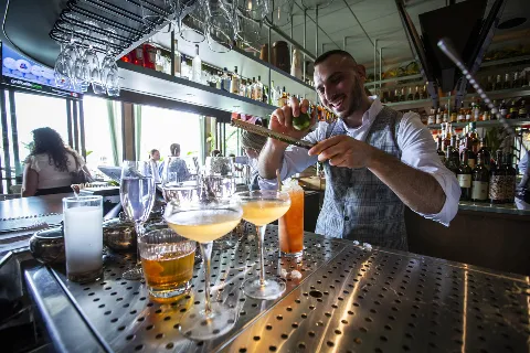 Bar chef creating a cocktail at Del Mar Mediterranean restaurant at Easton Town Center in Columbus, Ohio.