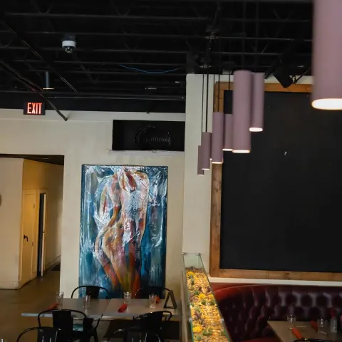 Table by a large wall painting.