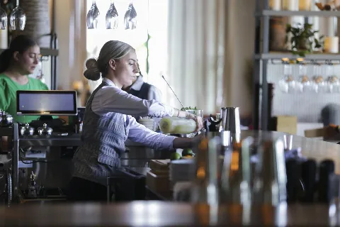 Bar chef creating a cocktail at Del Mar Mediterranean restaurant at Easton Town Center in Columbus, Ohio.