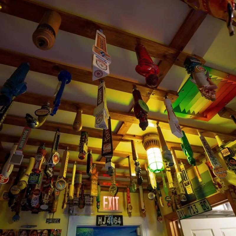 Papa's Raw Bar, beer taps repurposed for the ceiling decoration.