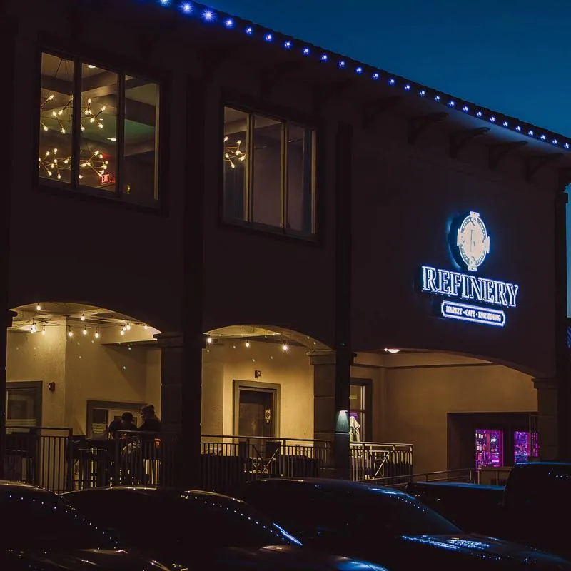 Refinery restaurant exterior at night.