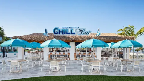 A Group Of Tables And Chairs Outside