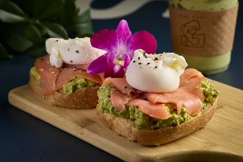 Avocado toast on homemade bread with smoked salmon and poached egg