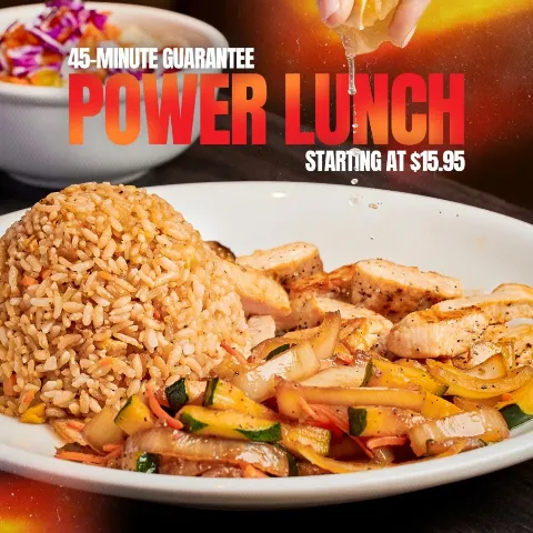 Lemon being squeezed over hibachi chicken, fried rice, and vegetables. Text overlay: 45-MINUTE GUARANTEE POWER LUNCH STARTING AT $15.95