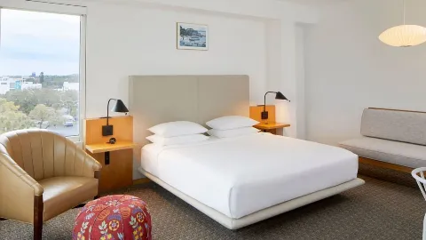 A Bedroom With A Large Window