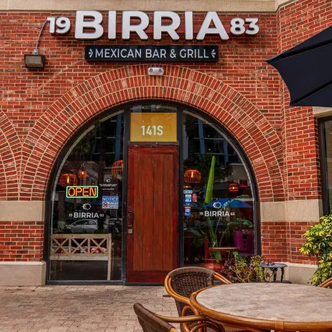 Birria 83 front door and sign.