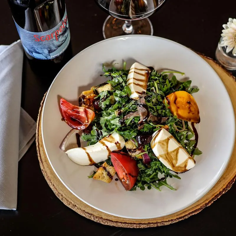 Arugula, cheese and tomato salad.