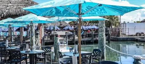 outside seating with tiki and docks in background