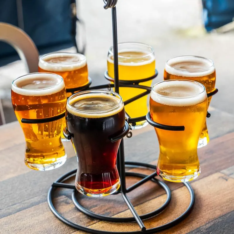 Beer Flight on a table outside.