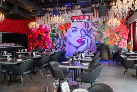 The KamiKoi dining room set with chandeliers and styled tables