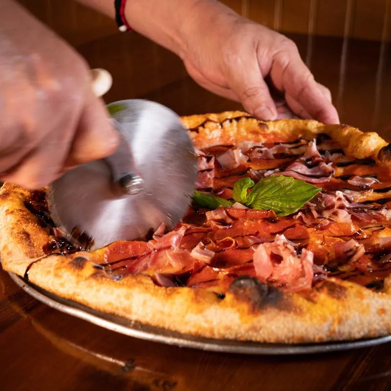 Cuting pizza.