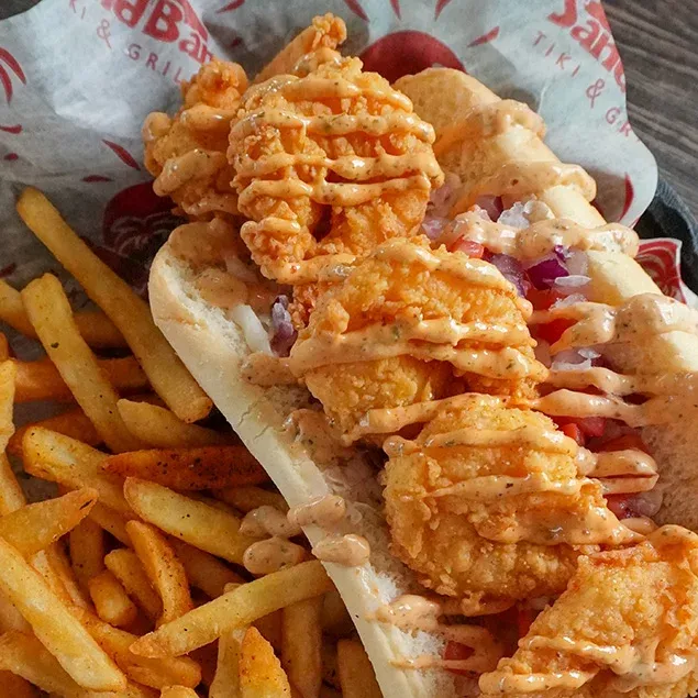 Hand breaded Shrimp deep fried to perfection, on a bed of our pineapple coleslaw with diced tomatoes, onion and remoulade sauce on a toasted hoagie roll.