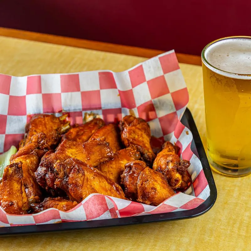 Bone in chicken wings and beer.