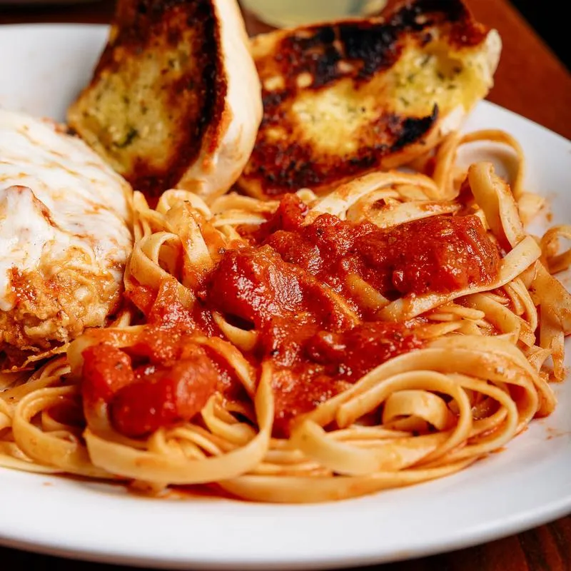 Served chicken parmesan in the plate