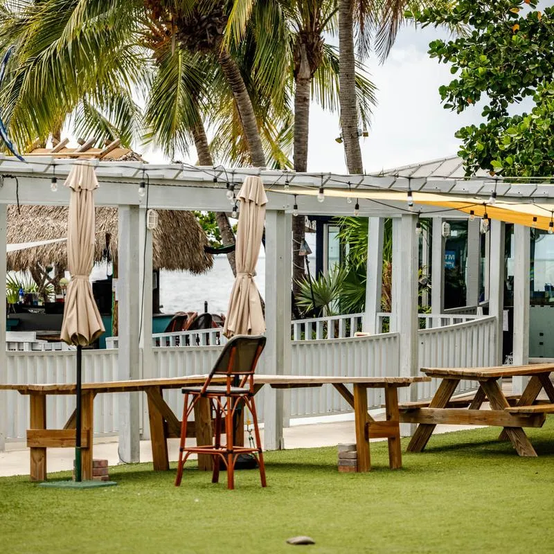 Outdoor seating area, picnic tables.