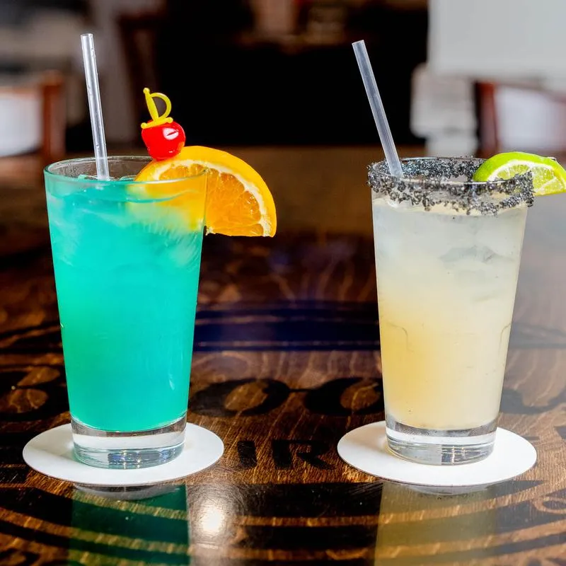 Nauti Mermaid and Scott's Magic Margarita on a bar counter.